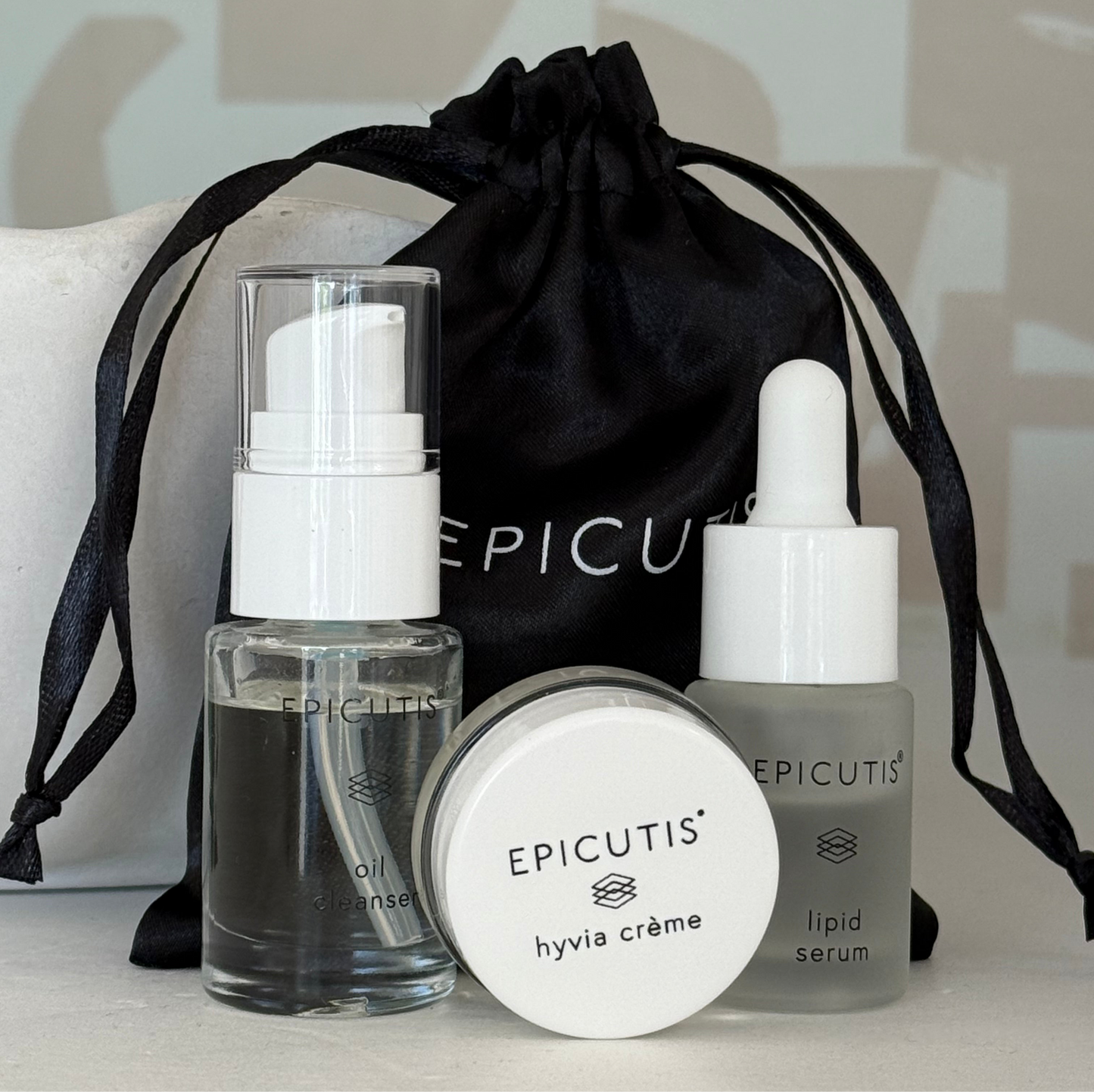 Epicutis mini 3 piece travel set featuring epicutis oil cleanser travel size, epicutis lipid serum travel size, and epicutis hyvia creme travel size