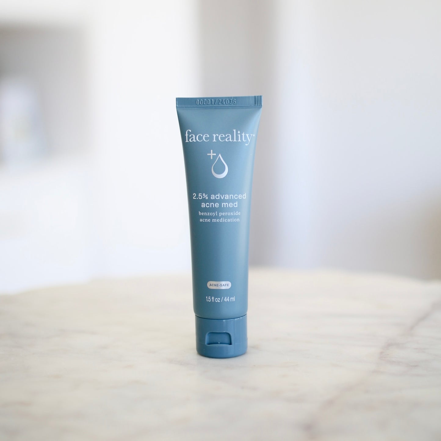 Face Reality 2.5% acne med product display at Clover Skin Bar