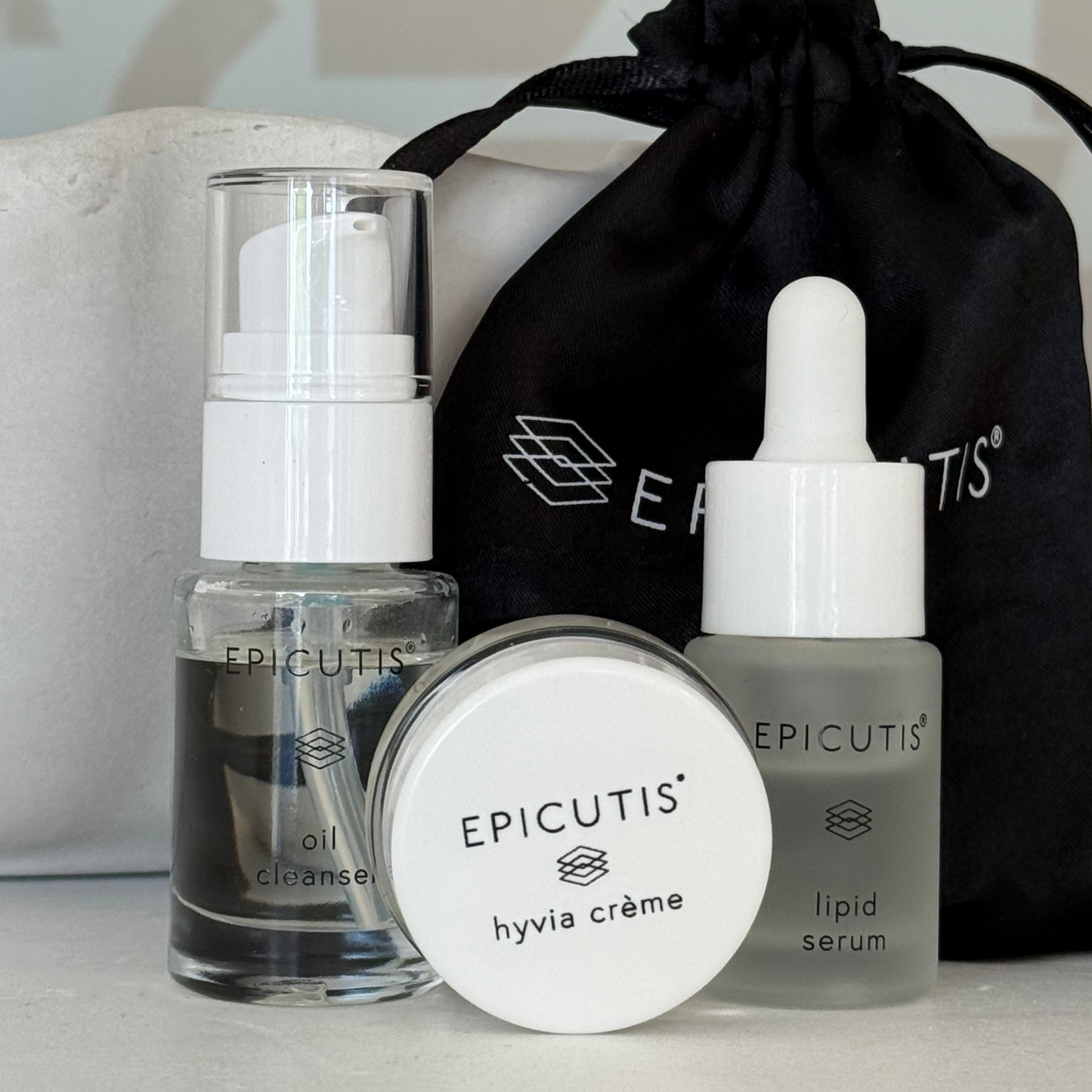 Epicutis mini 3 piece travel set featuring epicutis oil cleanser travel size, epicutis lipid serum travel size, and epicutis hyvia creme travel size