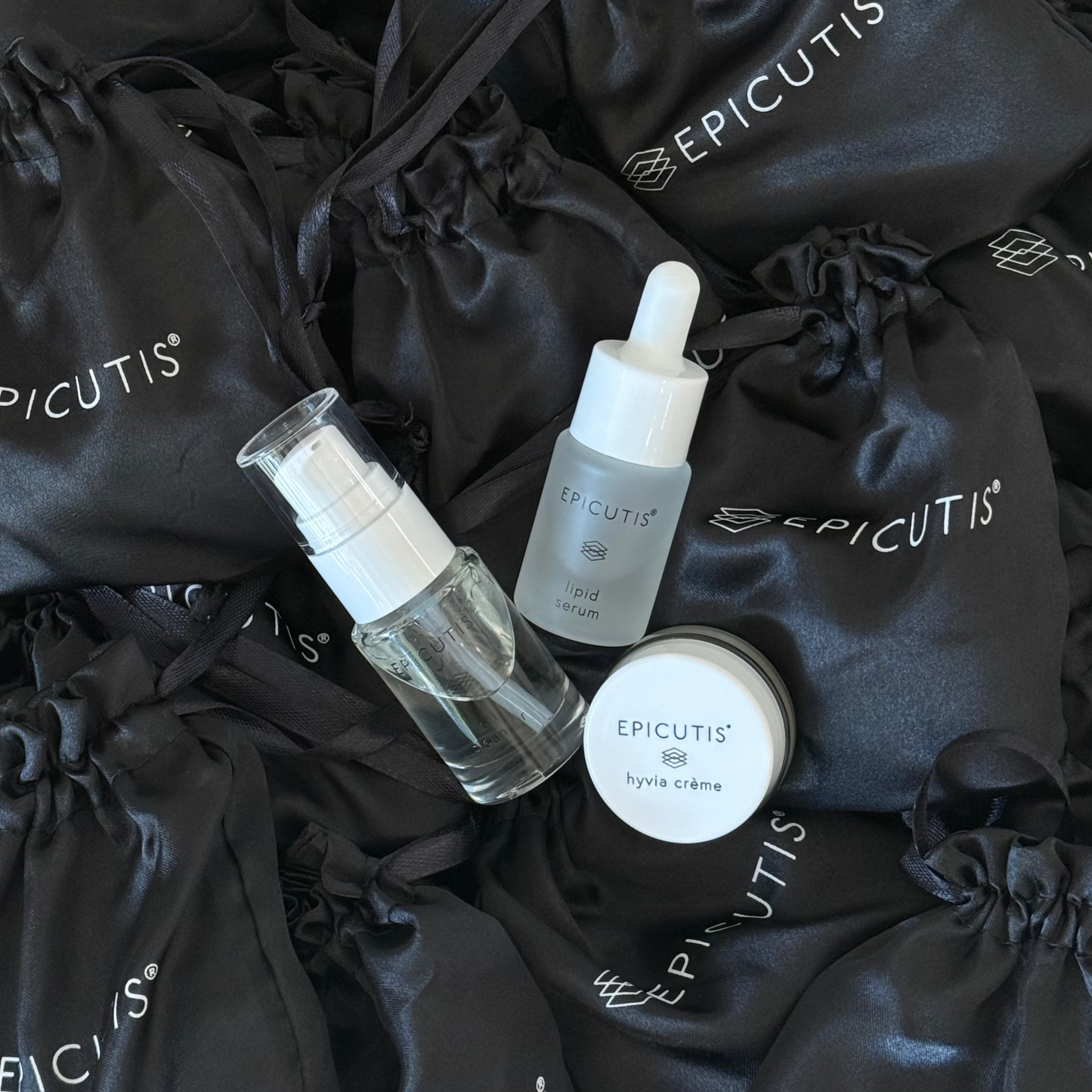 Epicutis mini 3 piece travel set featuring epicutis oil cleanser travel size, epicutis lipid serum travel size, and epicutis hyvia creme travel size