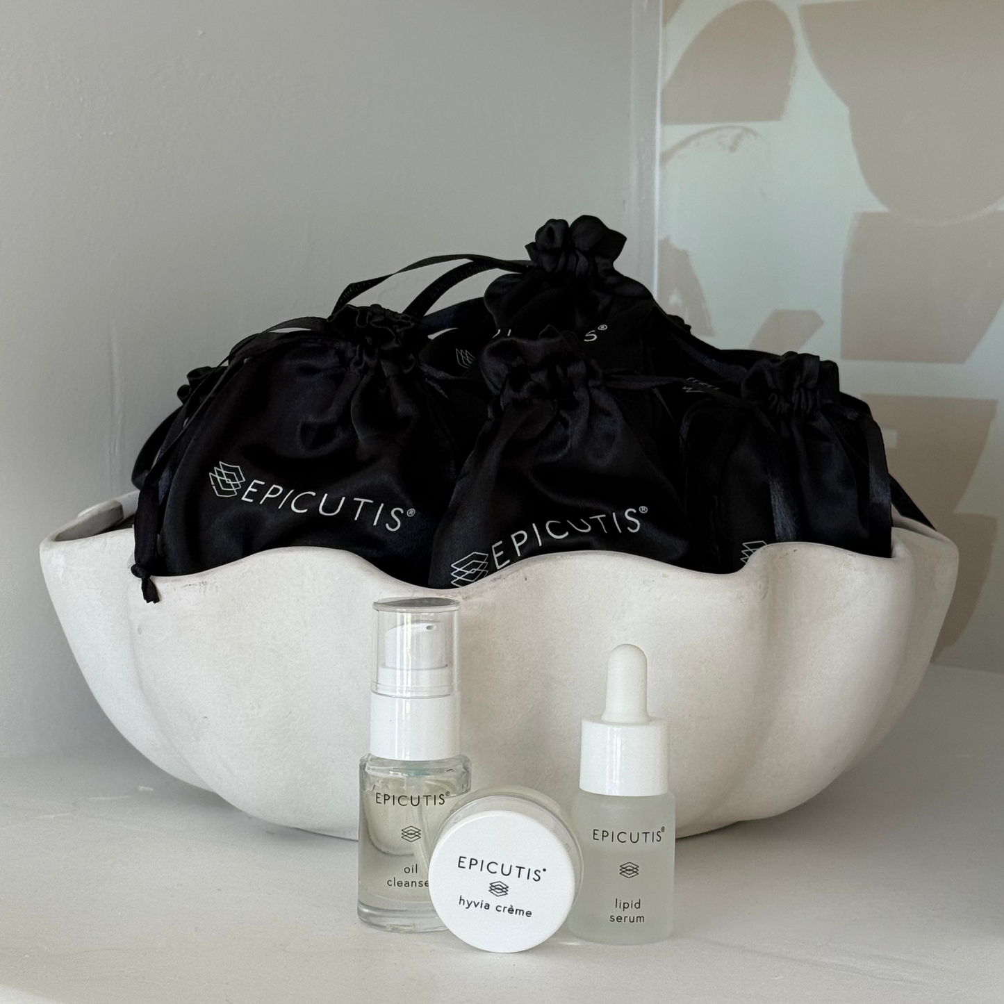 Epicutis mini 3 piece travel set featuring epicutis oil cleanser travel size, epicutis lipid serum travel size, and epicutis hyvia creme travel size