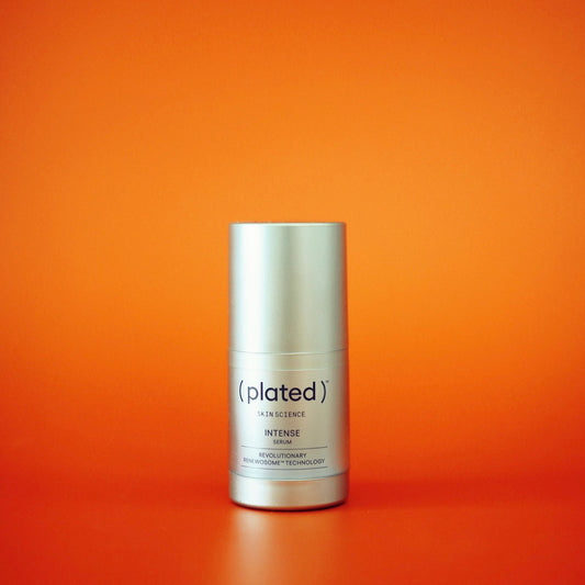 Plated Intense Serum bottle with an orange backdrop showing the medical-grade growth factor serum powered by plated-derived exosomes and Renewosome technology for sale at Clover Skin Bar