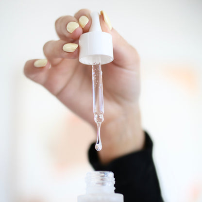 Epicutis Lipid Serum hydrating serum closeup of the dropper and lipid serum coming out of it