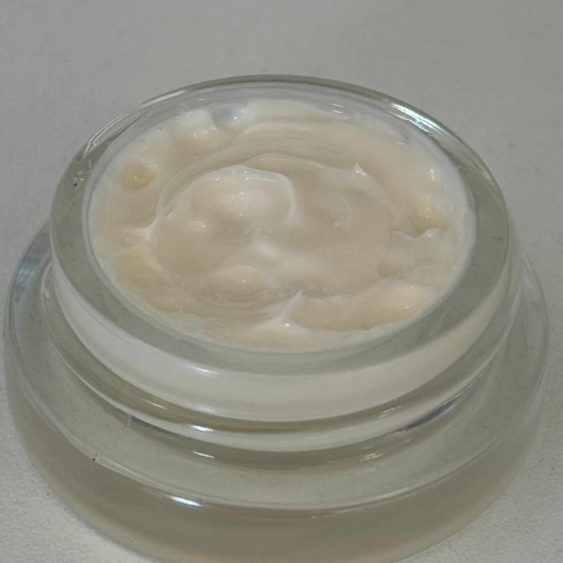 close up of the epicutis hyvia creme moisturizer showing the texture, thickness, and consistency of the moisturizer 